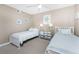 Charming bedroom with coastal décor, featuring twin beds and beach-themed artwork at 1591 Beach Rd # 402, Englewood, FL 34223