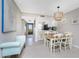 Open-concept dining area flows into kitchen with bright, neutral decor at 1591 Beach Rd # 402, Englewood, FL 34223
