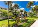 Beautiful three-story condo building has lush landscaping and a picnic area at 1591 Beach Rd # 402, Englewood, FL 34223