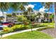 Beautiful three-story condo building has lush landscaping, sidewalks, and a picnic area at 1591 Beach Rd # 402, Englewood, FL 34223