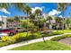 Beautiful three-story condo building has lush landscaping, sidewalks, and a picnic area at 1591 Beach Rd # 402, Englewood, FL 34223