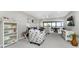 Bright living room features comfortable seating and balcony access with views at 1591 Beach Rd # 402, Englewood, FL 34223