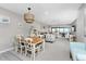 Spacious living room and dining area with water views and lots of seating at 1591 Beach Rd # 402, Englewood, FL 34223