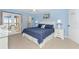 Spacious main bedroom with ample natural light and double doors to balcony at 1591 Beach Rd # 402, Englewood, FL 34223