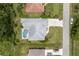 Aerial view of a home showcasing a pool and outdoor living space at 18112 Windswept Av, Port Charlotte, FL 33948