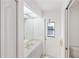Bathroom featuring a sink, mirror, and door leading to the outside at 18112 Windswept Av, Port Charlotte, FL 33948