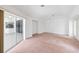 The bright bedroom is spacious and features a ceiling fan, neutral walls and carpeted floors at 18112 Windswept Av, Port Charlotte, FL 33948