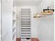 A walk-in closet offers ample storage with its built-in shelving and clothing racks at 18112 Windswept Av, Port Charlotte, FL 33948