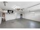 Spacious garage featuring an AC unit, water heater, and utility sink at 18112 Windswept Av, Port Charlotte, FL 33948
