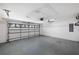 Spacious garage featuring a garage door with windows at 18112 Windswept Av, Port Charlotte, FL 33948