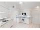 Bright kitchen with white cabinetry, granite countertops, and modern stainless steel appliances at 18112 Windswept Av, Port Charlotte, FL 33948