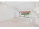Bright living room featuring tile and carpet flooring, a ceiling fan, and pool view at 18112 Windswept Av, Port Charlotte, FL 33948