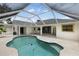 Gorgeous screened-in pool offering plenty of space and privacy for recreation and enjoying sunny days at 18112 Windswept Av, Port Charlotte, FL 33948