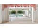 The bright sunroom offers a great view of the sparkling swimming pool and backyard at 18112 Windswept Av, Port Charlotte, FL 33948