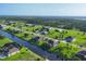 Aerial view of a residential neighborhood with canals at 204 W Pine Valley Ln, Rotonda West, FL 33947