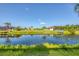 Water view of the backyard featuring a small dock on the canal at 204 W Pine Valley Ln, Rotonda West, FL 33947