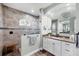 Bathroom with granite vanity, walk-in shower with bench, and elegant tile work throughout at 204 W Pine Valley Ln, Rotonda West, FL 33947