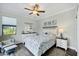 Guest bedroom with charming beach themed decor, a window view and a comfortable chair at 204 W Pine Valley Ln, Rotonda West, FL 33947