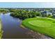 Picturesque golf course featuring well-manicured greens and a serene water hazard at 204 W Pine Valley Ln, Rotonda West, FL 33947