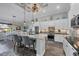 Stylish kitchen with stainless steel appliances, granite counters, an island with bar seating, and backyard views at 204 W Pine Valley Ln, Rotonda West, FL 33947