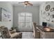 Bright office space with a large window, stylish furnishings, and calming decor at 204 W Pine Valley Ln, Rotonda West, FL 33947