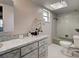Bright bathroom showcasing tile flooring, a classic shower/tub, and a vanity with marble accents at 21519 Fairway Ave, Port Charlotte, FL 33952