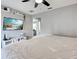 Bedroom features a ceiling fan, neutral decor and TV at 21519 Fairway Ave, Port Charlotte, FL 33952
