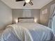 Bedroom features a ceiling fan and neutral decor at 21519 Fairway Ave, Port Charlotte, FL 33952