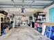 A well-organized garage with storage shelves, laundry area, and ample space for tools and equipment at 21519 Fairway Ave, Port Charlotte, FL 33952