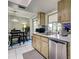 Kitchen featuring stainless appliances, stone countertops, and dining area at 21519 Fairway Ave, Port Charlotte, FL 33952