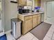 Kitchen features stainless steel appliances, granite countertops, and tile backsplash at 21519 Fairway Ave, Port Charlotte, FL 33952