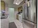 Stainless steel appliances and a skylight brighten this kitchen at 21519 Fairway Ave, Port Charlotte, FL 33952