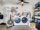 A well-equipped laundry room with a modern washer and dryer, shelving and ample space for laundry tasks at 21519 Fairway Ave, Port Charlotte, FL 33952