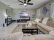 Inviting living room with tile flooring, soft furnishings, and a modern entertainment setup at 21519 Fairway Ave, Port Charlotte, FL 33952
