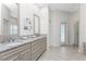 Elegant bathroom with double vanity, granite counters, and a glass enclosed shower at 22 Par View Rd, Rotonda West, FL 33947
