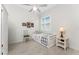 Bright bedroom features a ceiling fan, wood floors, and natural light at 22 Par View Rd, Rotonda West, FL 33947