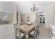 Open-concept dining room featuring stylish decor, a neutral color palette, and seamless flow to the kitchen at 22 Par View Rd, Rotonda West, FL 33947