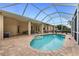 Backyard features a screened pool area with an extended covered patio at 22 Par View Rd, Rotonda West, FL 33947