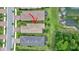 Scenic aerial view of the neighborhood features well-kept homes, with a pond, and lush greenery at 2592 Brassica Dr, North Port, FL 34289