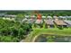The area features well-kept homes, a tranquil pond, and lush greenery, all in a serene neighborhood at 2592 Brassica Dr, North Port, FL 34289