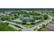 Aerial view of the community with resort-style amenities like swimming pools, tennis courts and waterways at 2592 Brassica Dr, North Port, FL 34289