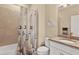 Well-lit bathroom with bathtub, shower, and stylish nautical decor at 2592 Brassica Dr, North Port, FL 34289