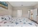 Bedroom with a comfortable bed and ensuite bathroom access at 2592 Brassica Dr, North Port, FL 34289