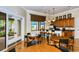 Beautiful clubhouse with tables and chairs, a kitchen, and natural light creating a social gathering space at 2592 Brassica Dr, North Port, FL 34289