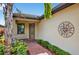 Inviting entryway with a decorative front door, sidelight window, and brick walkway at 2592 Brassica Dr, North Port, FL 34289