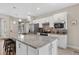 Modern kitchen with granite counters, stainless appliances, and a large center island with seating at 2592 Brassica Dr, North Port, FL 34289