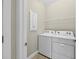 Efficient laundry area equipped with a washer and dryer at 2592 Brassica Dr, North Port, FL 34289
