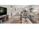 Open-concept living room, offering a view into the kitchen and dining areas at 2592 Brassica Dr, North Port, FL 34289