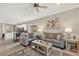 Open concept living room adjacent to the kitchen and dining area at 2592 Brassica Dr, North Port, FL 34289