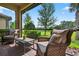 Inviting screened patio with comfortable seating and a serene view of the outdoors at 2592 Brassica Dr, North Port, FL 34289